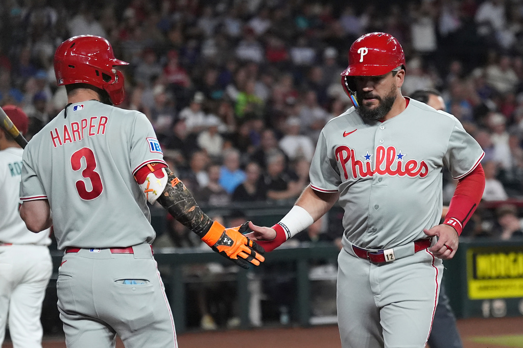 Philadelphia Phillies' Kyle Schwarber, right, celebrates his run scored against the Arizona Diamondbacks with Phillies' Bryce Harper (3) during the first inning of a baseball game, Tuesday, Sept. 1, 2026, in Phoenix. (AP Photo/Ross D. Franklin)