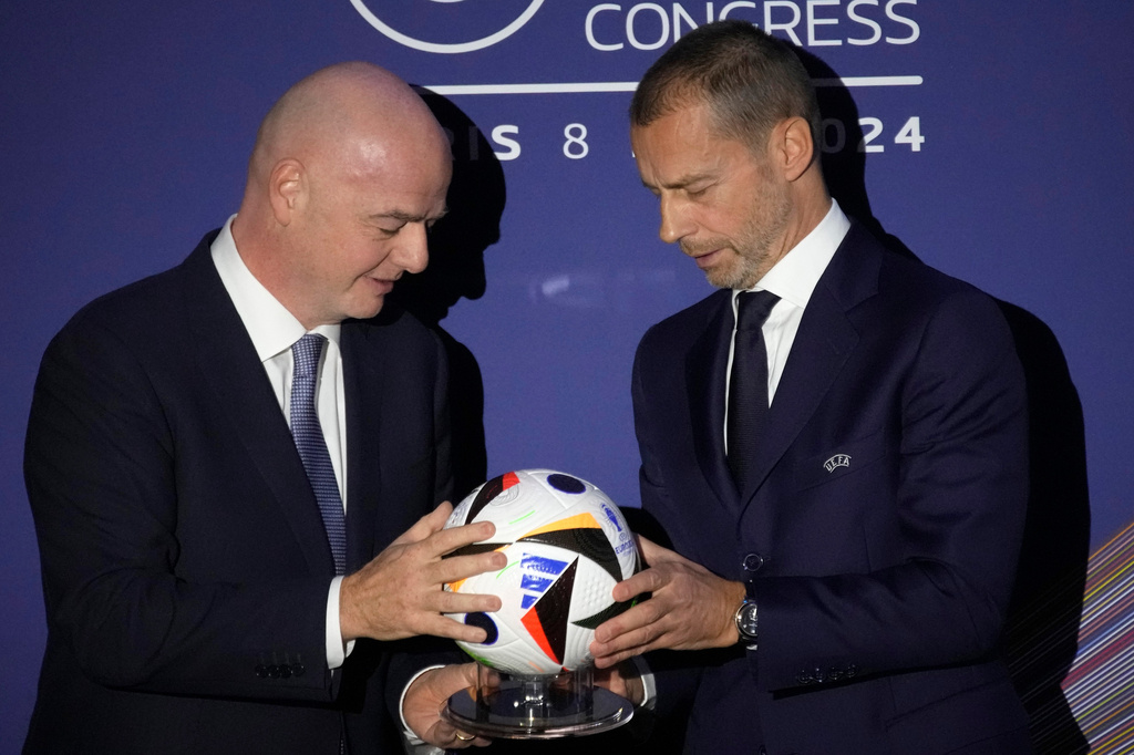 FILE - UEFA President Aleksander Ceferin, right, and FIFA President Gianni Infantino pose during the 48th UEFA congress in Paris, Thursday, Feb. 8, 2024. (AP Photo/Christophe Ena, File)