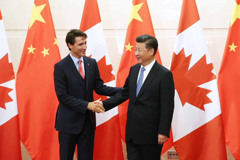FILE - China's President Xi Jinping, right, shakes hands with Canada's Prime Minister Justin Trudeau before their meeting at the Diaoyutai State Guesthouse in Beijing, China, Wednesday, Aug. 31, 2016. (Wu Hong/Pool Photo via AP, File)