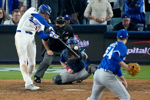 Los Angeles Dodgers' Freddie Freeman connects for a grand slam home run off Toronto Blue Jays' pitcher Brendon Little (54) during the 18th inning in Game 3 of baseball's World Series, Monday, Oct. 27, 2025, in Los Angeles. (AP Photo/David J. Phillip) Los Angeles Dodgers' Freddie Freeman connects for a grand slam home run off Toronto Blue Jays' pitcher Brendon Little (54) during the 18th inning in Game 3 of baseball's World Series, Monday, Oct. 27, 2025, in Los Angeles. (AP Photo/David J. Phillip)