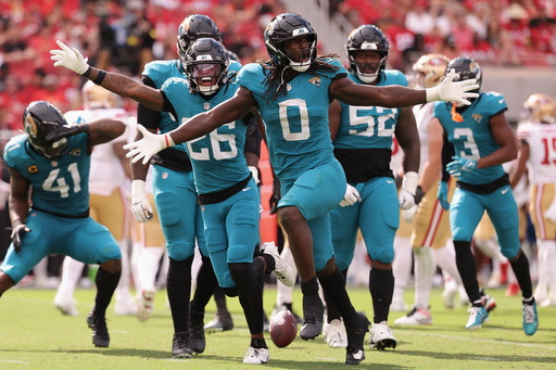Jacksonville Jaguars linebacker Devin Lloyd (0) celebrates with teammates after intercepting a pass against the San Francisco 49ers during the second half of an NFL football game in Santa Clara, Calif., Sunday, Sept. 28, 2025. (AP Photo/Kelley L. Cox) Jacksonville Jaguars linebacker Devin Lloyd (0) celebrates with teammates after intercepting a pass against the San Francisco 49ers during the second half of an NFL football game in Santa Clara, Calif., Sunday, Sept. 28, 2025. (AP Photo/Kelley L. Cox)
