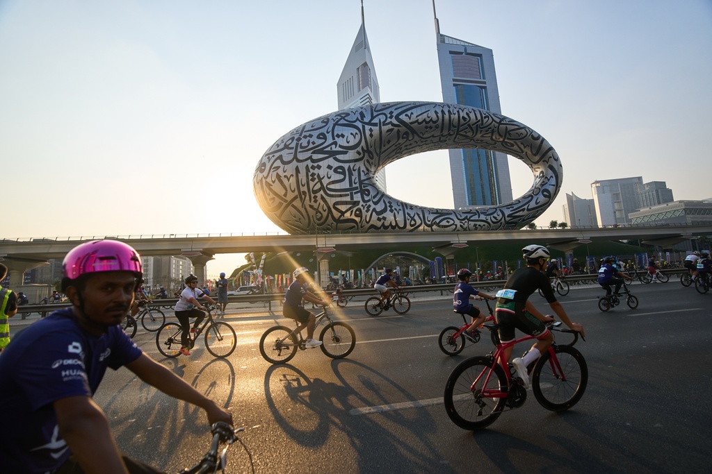 Bicyclists ride along Sheikh Zayed highway during the Dubai Ride annual event in Dubai, United Arab Emirates, Sunday, Nov. 2, 2025. (AP Photo/ Fatima Shbair)