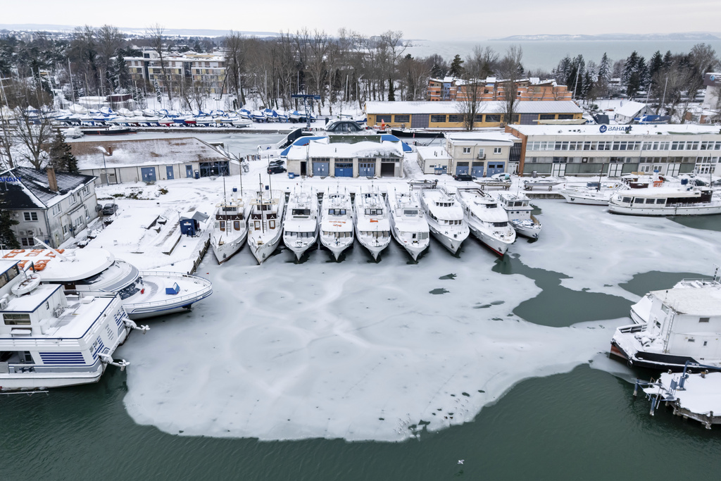 Ice builds up at a pier of Lake Balaton at Siofok, Hungary, Wednesday, Jan. 7, 2026. (Tamas Vasvari/MTI via AP)/MTI via AP)