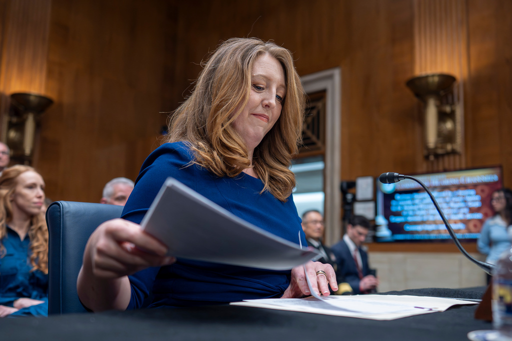 Wellness influencer and entrepreneur Dr. Casey Means takes her seat before the Senate health committee as she seeks approval to be U.S. surgeon general, at the Capitol in Washington, Wednesday, Feb. 25, 2026. (AP Photo/J. Scott Applewhite)