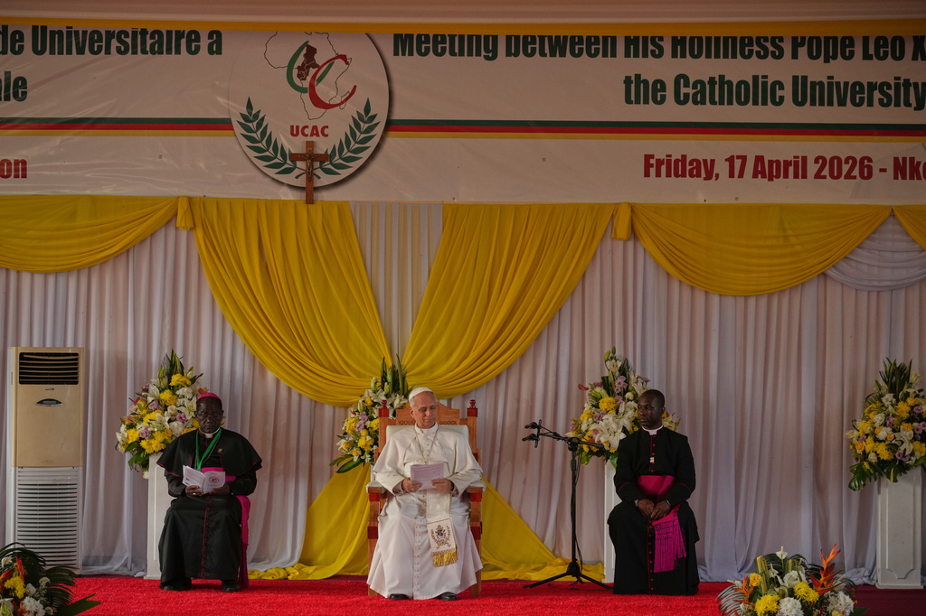 Pope Leo XIV, center, meets with University students and professors at the Catholic University of Central Africa, in Yaounde Cameroon, Friday, April 17, 2026. (AP Photo/Andrew Medichini)