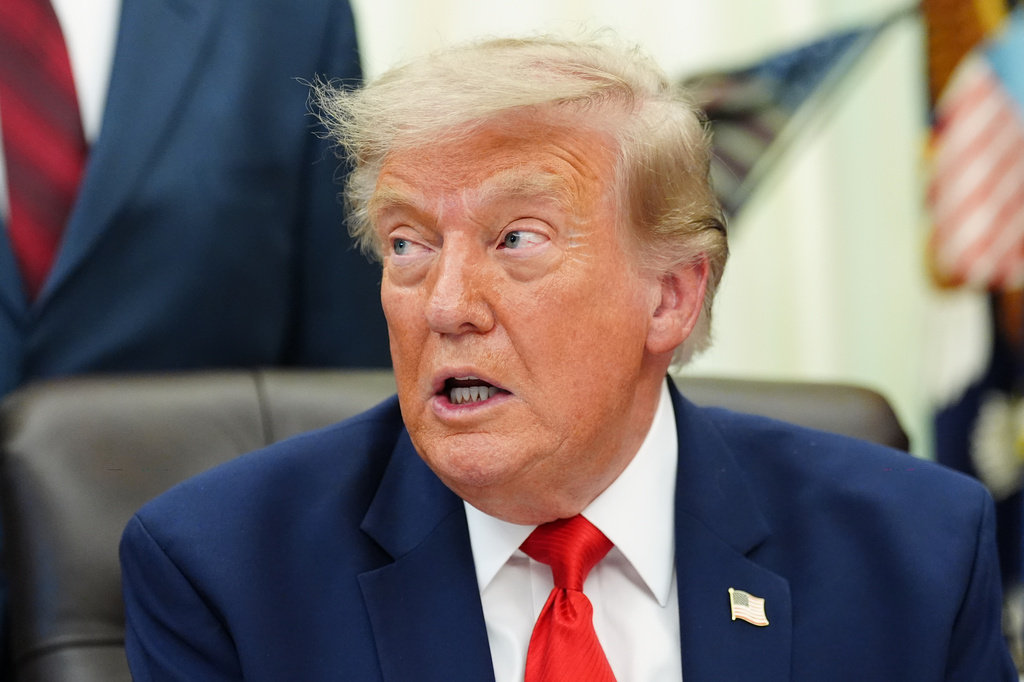 President Donald Trump speaks in the Oval Office of the White House about Dulles International Airport modernization, Wednesday, July 29, 2026, in Washington. (AP Photo/Julia Demaree Nikhinson)