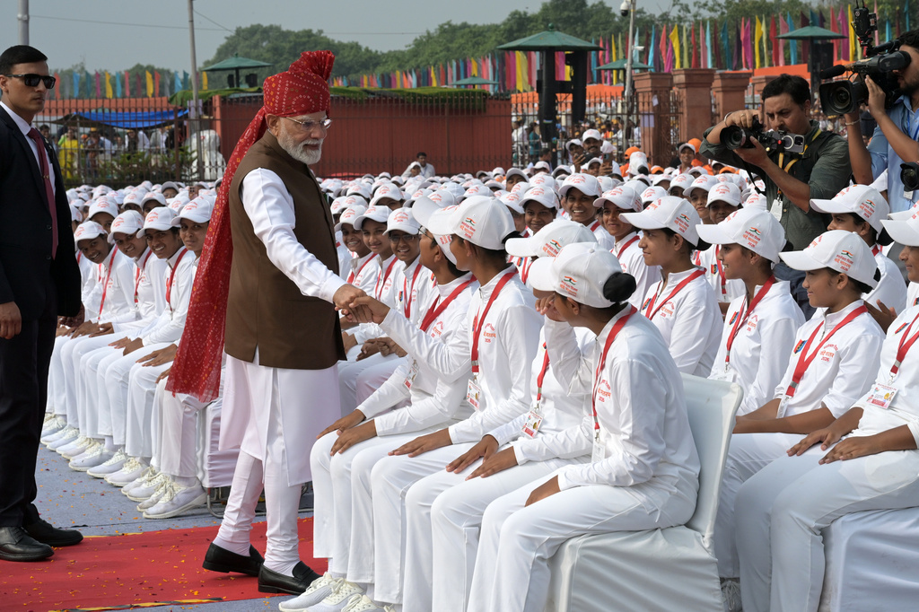 Indian Prime Minister Narendra Modi greets children after addressing the nation from the rampart of the Red Fort monument during the country's Independence Day celebrations in New Delhi, India, Saturday, Aug. 15, 2026. (AP Photo/Sanjeev Rastogi)
