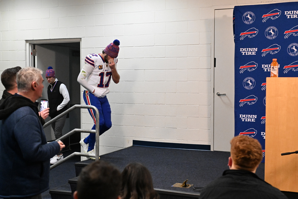 Buffalo Bills quarterback Josh Allen enters a news conference after an NFL divisional playoff game against the Denver Broncos, Saturday, Jan. 17, 2026, in Denver. (AP Photo/RJ Sangosti)