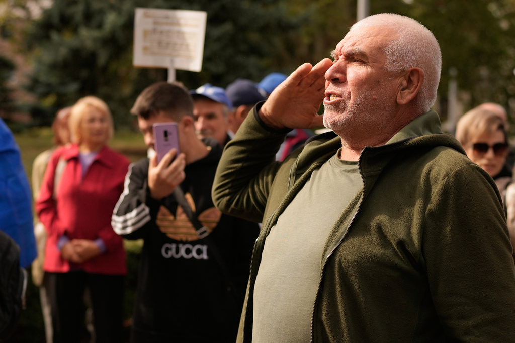 Vasile Chiriac, 66, salutes during a pro-EU rally in Chisinau, Moldova, Monday, Sept. 29, 2025, after the parliamentary election. (AP Photo/Vadim Ghirda)