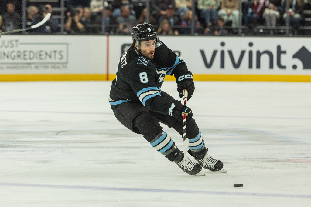 Utah Mammoth center Nick Schmaltz (8) skates with the puck against the Ottawa Senators during the first period of an NHL hockey game Wednesday, Jan. 7, 2026, in Salt Lake City. (AP Photo/Melissa Majchrzak)