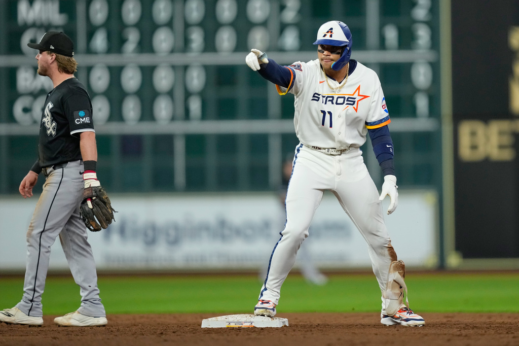 Houston Astros' Cam Smith celebrates after hitting a two-run double against the Chicago White Sox during the fifth inning of a baseball game Monday, Aug. 31, 2026, in Houston. (AP Photo/David J. Phillip)