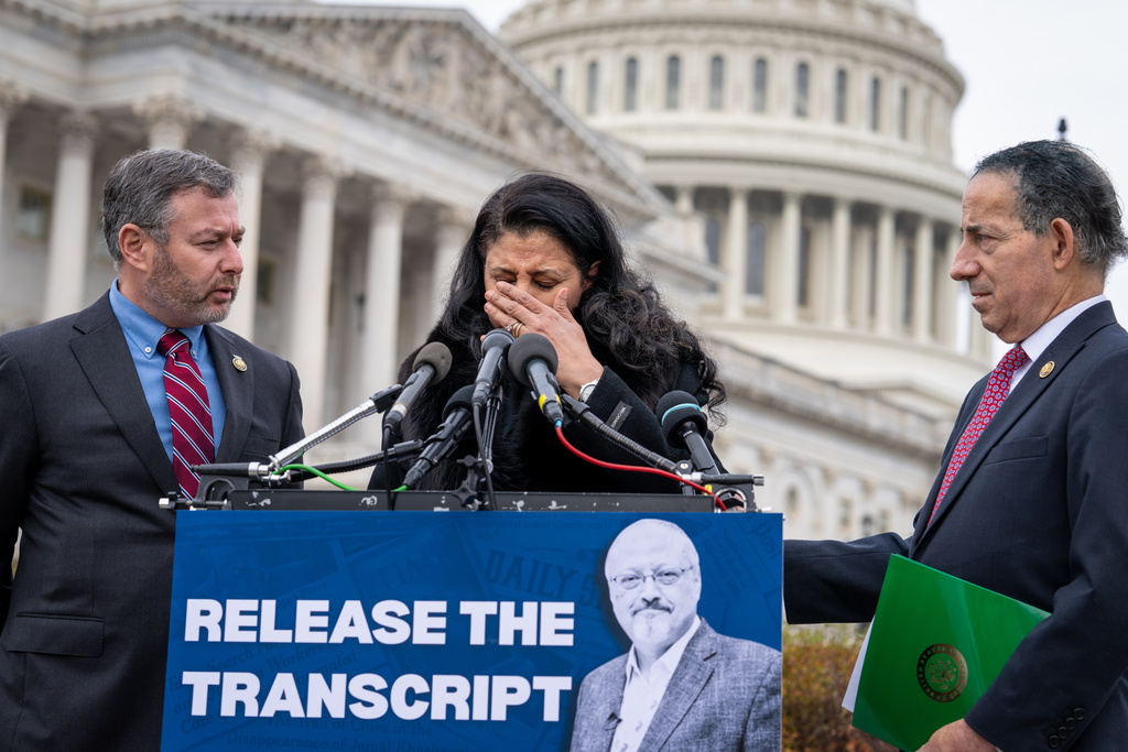 From left, Rep. Eugene Vindman, D-Va., Hanan El-Atr Khashoggi, the widow of slain journalist Jamal Khashoggi, and Rep. Jamie Raskin, D-Md., hold a news conference as they call on President Donald Trump to release the transcript of a call he had with Saudi Crown Prince Mohammed bin Salman after Khashoggi's killing, at the Capitol in Washington, Friday, Nov. 21, 2025. (AP Photo/J. Scott Applewhite)