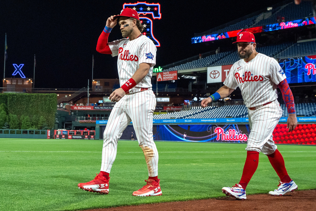 Philadelphia Phillies' Bryce Harper, left, and Kyle Schwarber, right, heads back to the clubhouse following TV interviews after a baseball game against the New York Mets, Saturday, June 20, 2026, in Philadelphia. (AP Photo/Chris Szagola)