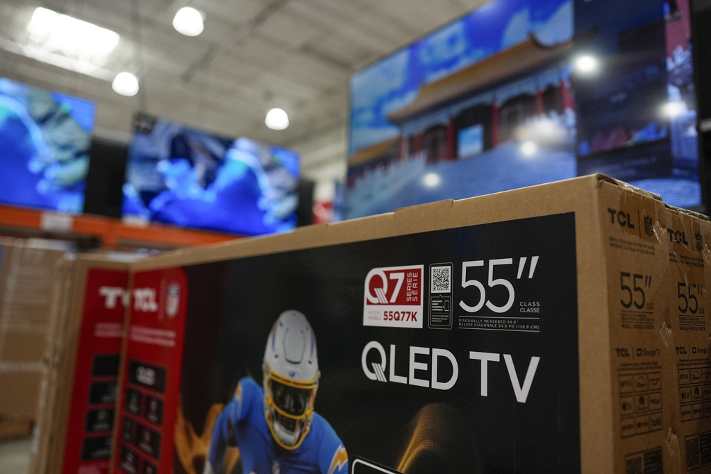 New televisions are displayed for sale at a store in Kennesaw, Ga., on Thursday, Aug. 14, 2025. (AP Photo/Mike Stewart)