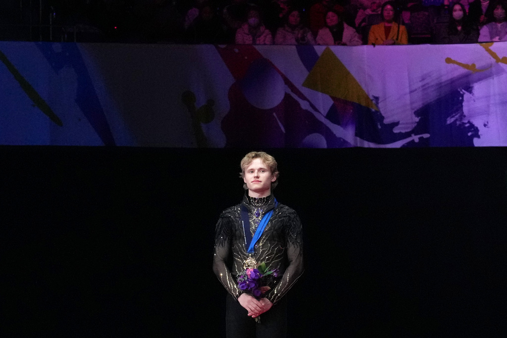 Ilia Malinin, of the United States, stands on the podium after winning the gold medal in the men's event at the ISU Grand Prix of Figure Skating Final in Nagoya, central Japan, Saturday, Dec. 6, 2025. (AP Photo/Hiro Komae)