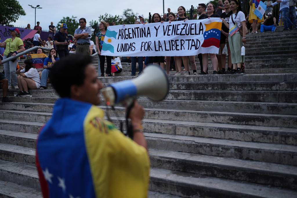 Members of Venezuelan's opposition demonstrate ahead of the Nobel Peace Prize ceremony where Venezuelan Maria Corina Machado is among this year's laureates, in Buenos Aires, Argentina, Saturday, Dec. 6, 2025. (AP Photo/Rodrigo Abd))