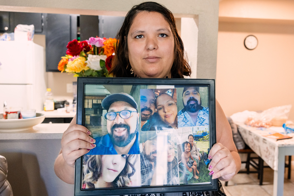 Yesenia holds a collage of photographs of Ram&oacute;n Barraza and his family, March 3, 2026, at the Phoenix apartment the couple shared. (Daniel Robles/Conecta Arizona via AP)