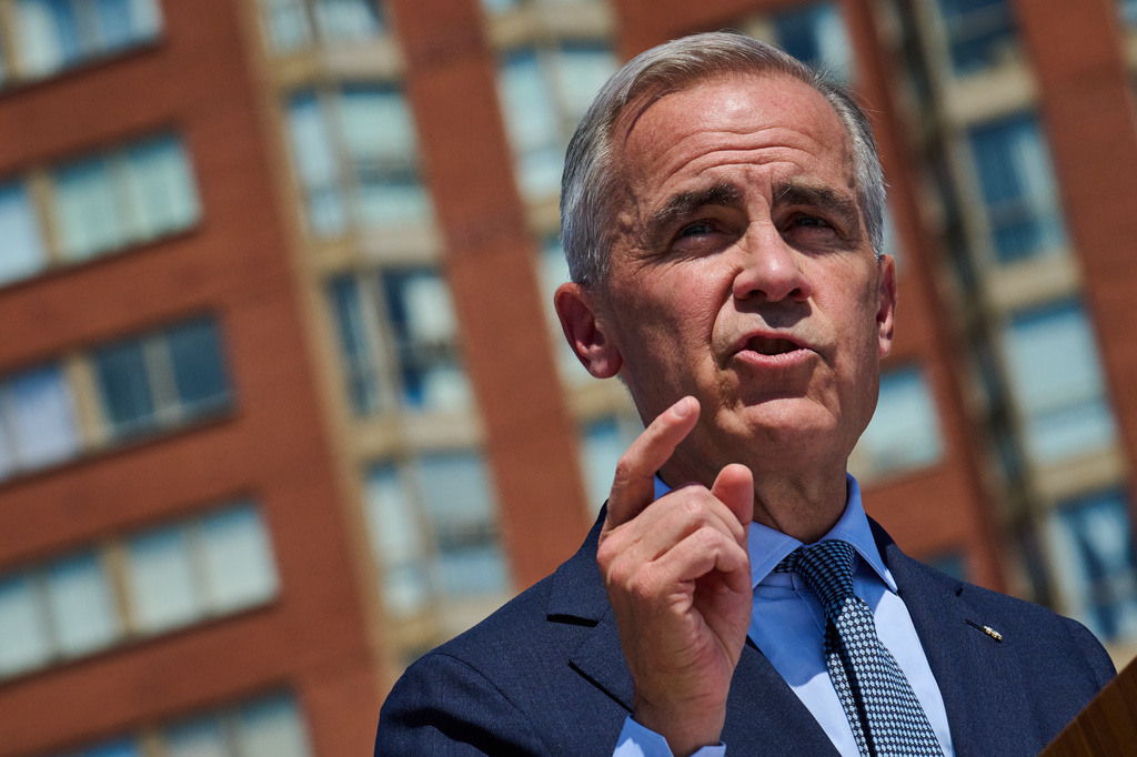 Prime Minister Mark Carney speaks at a housing announcement in Toronto, on Wednesday, Aug. 5, 2026. (Sammy Kogan/The Canadian Press via AP)