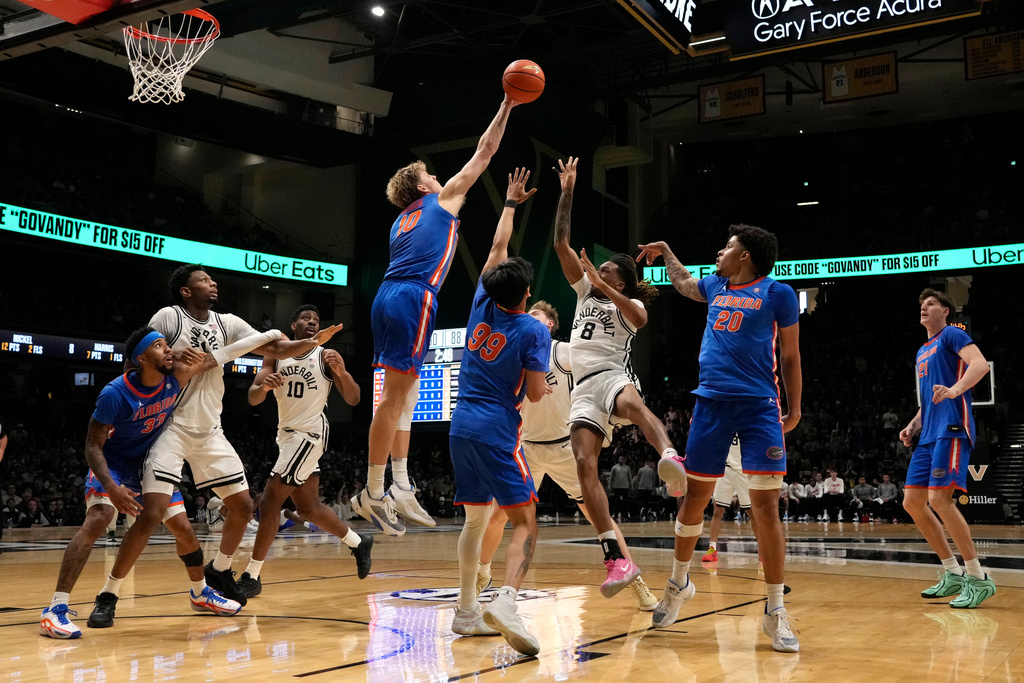 Florida's Thomas Haugh (10) blocks a shot by Vanderbilt's Tyler Harris (8) in the second half of an NCAA college basketball game Saturday, Jan. 17, 2026, in Nashville, Tenn. (AP Photo/Mark Humphrey)