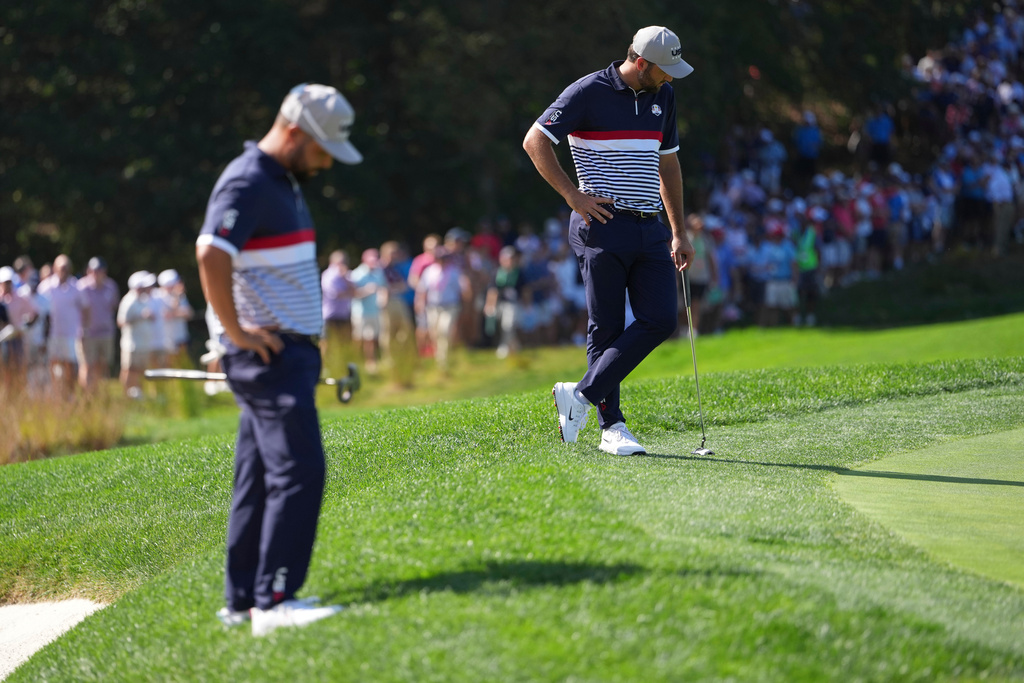 United States' Scottie Scheffler waits to play on the sixth hole at Bethpage Black golf course during the Ryder Cup golf tournament, Friday, Sept. 26, 2025, in Farmingdale, N.Y. (AP Photo/Matt Slocum)