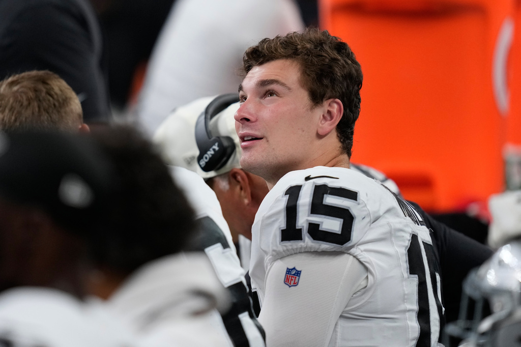 Las Vegas Raiders quarterback Fernando Mendoza (15) sits on the bench during the second half of an NFL preseason football game against the Houston Texans, Thursday, Aug. 20, 2026, in Houston. (AP Photo/David J. Phillip)