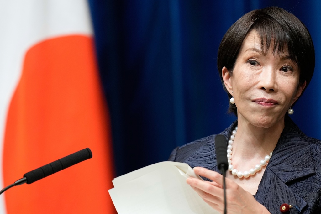 Japan's new Prime Minister Sanae Takaichi listens a question from a journalist during a press conference at the prime minister's office in Tokyo, Japan, Tuesday, Oct. 21, 2025. (AP Photo/Eugene Hoshiko, Pool)
