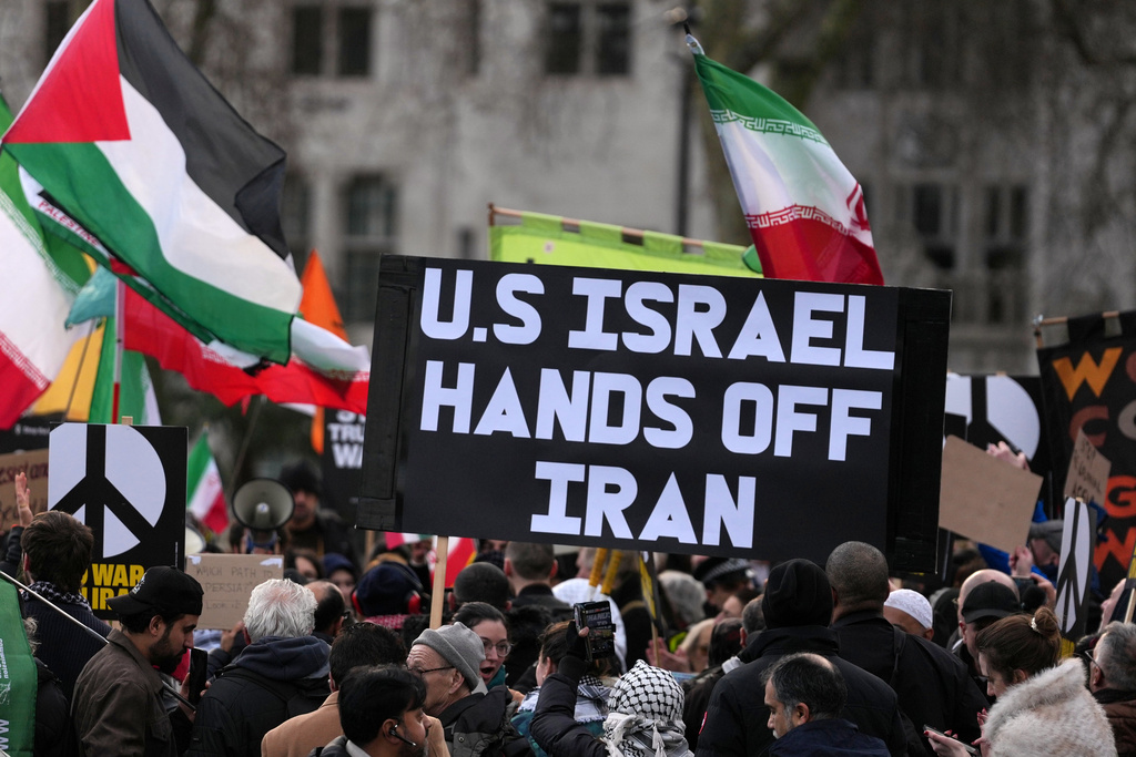 Protesters gather in London, Saturday, Feb. 28, 2026 after U.S. and Israeli forces carried out a series of strikes on Iran on Saturday morning. (AP Photo/Alastair Grant)