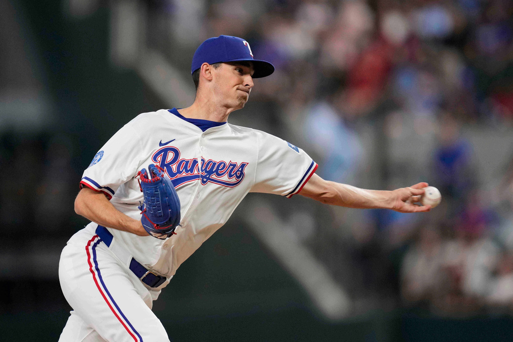 FILE - Texas Rangers relief pitcher Hoby Milner works against the Arizona Diamondbacks during a baseball game Wednesday, Aug. 13, 2025, in Arlington, Texas. (AP Photo/Tony Gutierrez, File)
