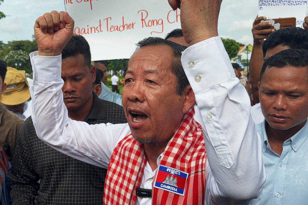 Rong Chhun, a top adviser to the Nation Power Party and a prominent opposition politician, stands with supporters outside Cambodia's Supreme Court in Phnom Penh, Friday, June 19, 2026. (AP Photo/Sopheng Cheang)