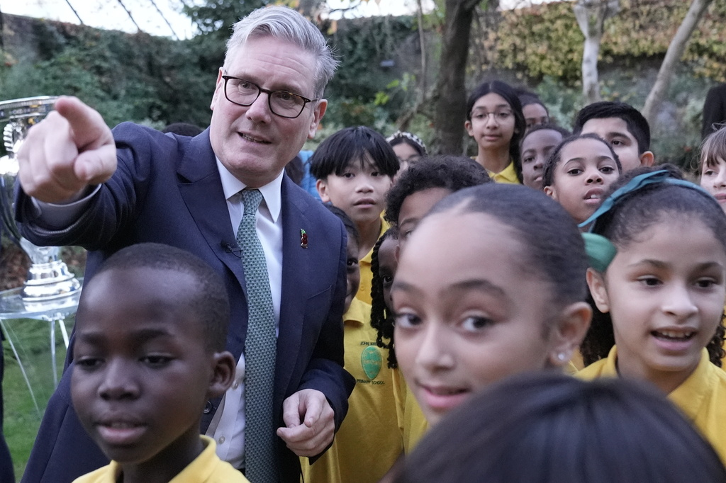 Britain's Prime Minister Sir Keir Starmer welcomes children from John Keble CofE Primary School to number 10 Downing Street to mark the launch of the Euro 2028 soccer tournament, in London, Wednesday, Nov. 12, 2025. (Stefan Rousseau/Pool Photo via AP)