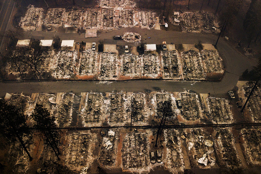 FILE - The remains of homes leveled by the Camp wildfire, appear in Paradise, Calif., on Nov. 15, 2018. (AP Photo/Noah Berger, File) FILE - The remains of homes leveled by the Camp wildfire, appear in Paradise, Calif., on Nov. 15, 2018. (AP Photo/Noah Berger, File)