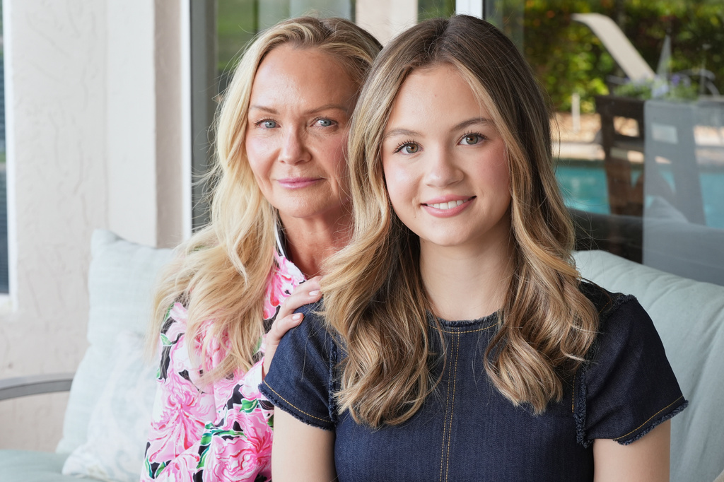 Lauryn Muller sits with her mother, Marylin, at their home Monday, April 13, 2026, in Coral Springs, Fla. (AP Photo/Marta Lavandier)