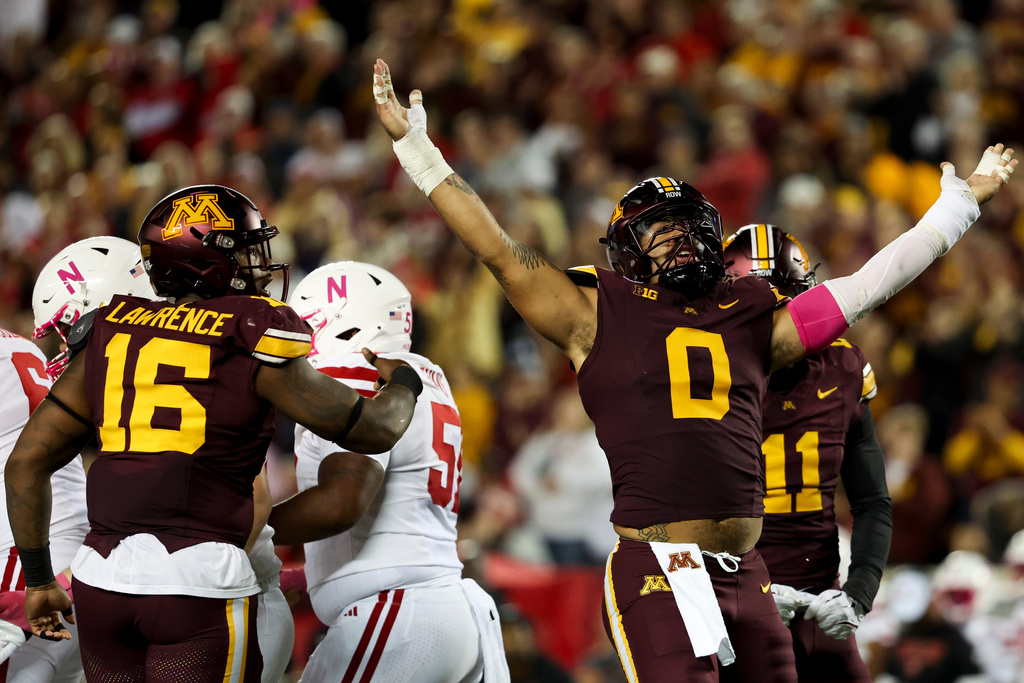 Minnesota defensive lineman Anthony Smith (0) celebrates after sacking Nebraska quarterback Dylan Raiola, out of frame, during the first half of an NCAA college football game Friday, Oct. 17, 2025, in Minneapolis. (AP Photo/Ellen Schmidt)