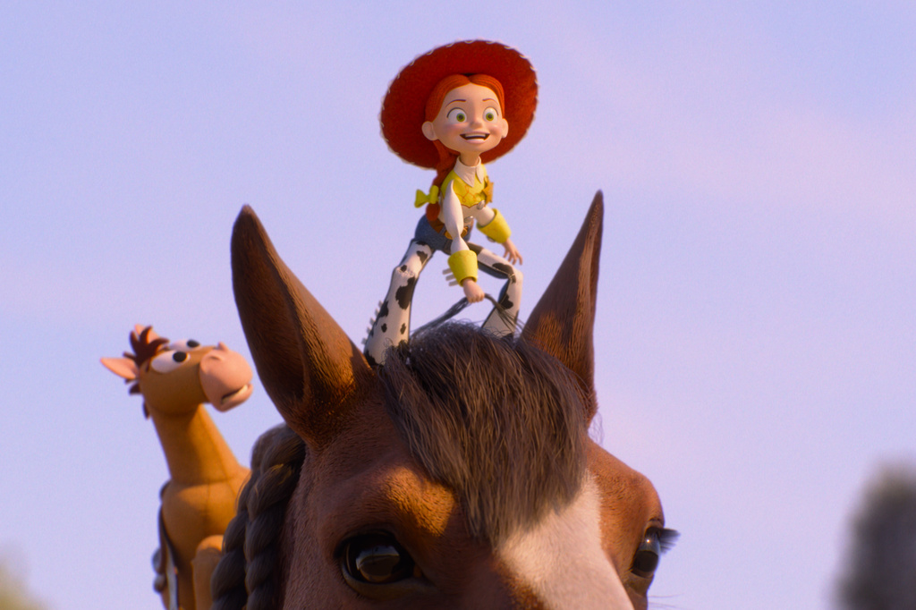 This image released by Pixar shows the characters Bullseye and Jessie, voiced by Joan Cusack, center, in a scene from "Toy Story 5." (Pixar-Disney via AP)