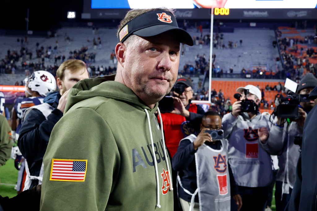 Auburn head coach Hugh Freeze walks off the field after a loss to Kentucky in an NCAA college football game, Saturday, Nov. 1, 2025, in Auburn, Ala. (AP Photo/Butch Dill)