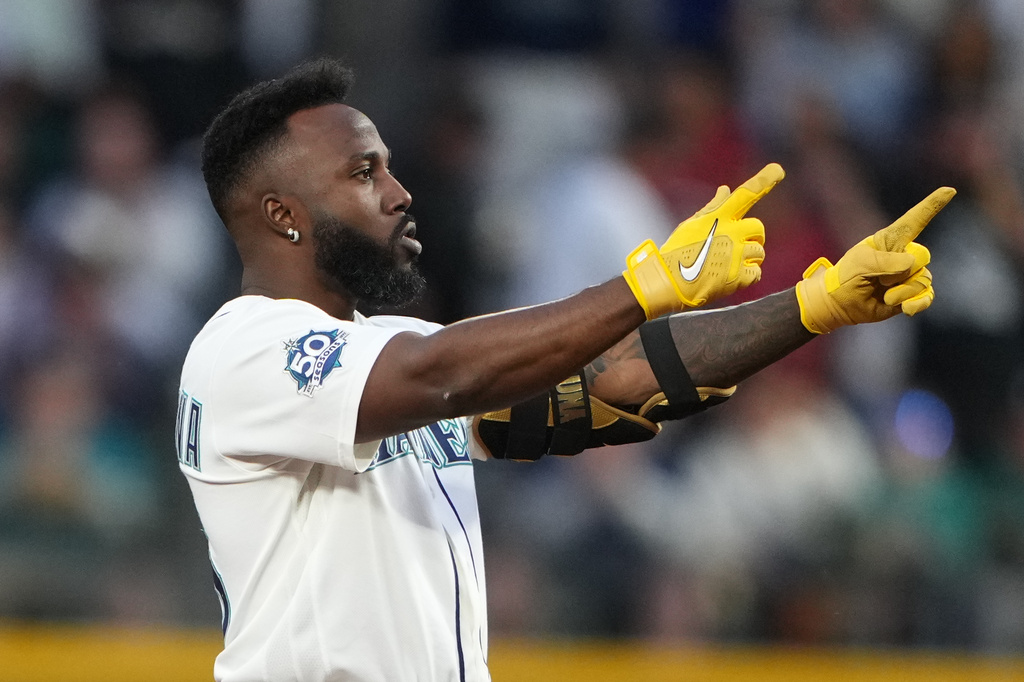 Seattle Mariners' Randy Arozarena reacts after hitting a double against the Chicago White Sox during the sixth inning of a baseball game, Monday, May 18, 2026, in Seattle. (AP Photo/Lindsey Wasson)
