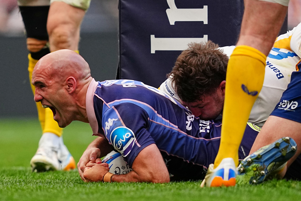 Bordeaux's Maxime Lucu celebrates after scoring a try during the European Champions Cup final rugby union match between Leinster and Bordeaux in Bilbao, Spain, Saturday, May 23, 2026. (AP Photo/Miguel Oses)
