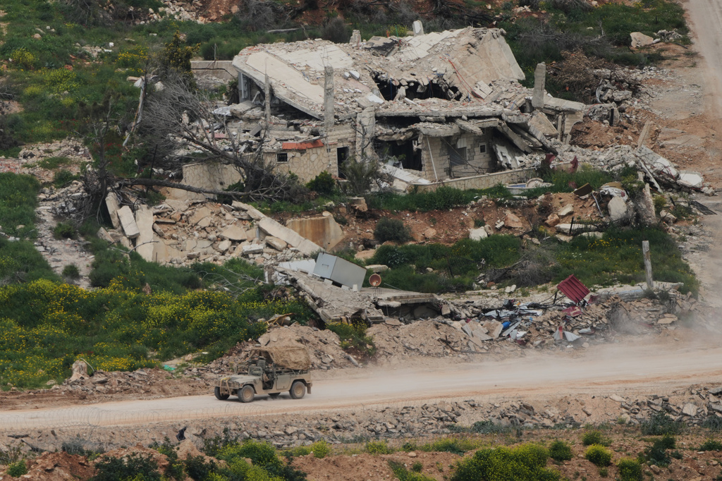 Israeli soldiers drive through southern Lebanon, as seen from northern Israel, Wednesday, April 15, 2026. (AP Photo/Ariel Schalit)