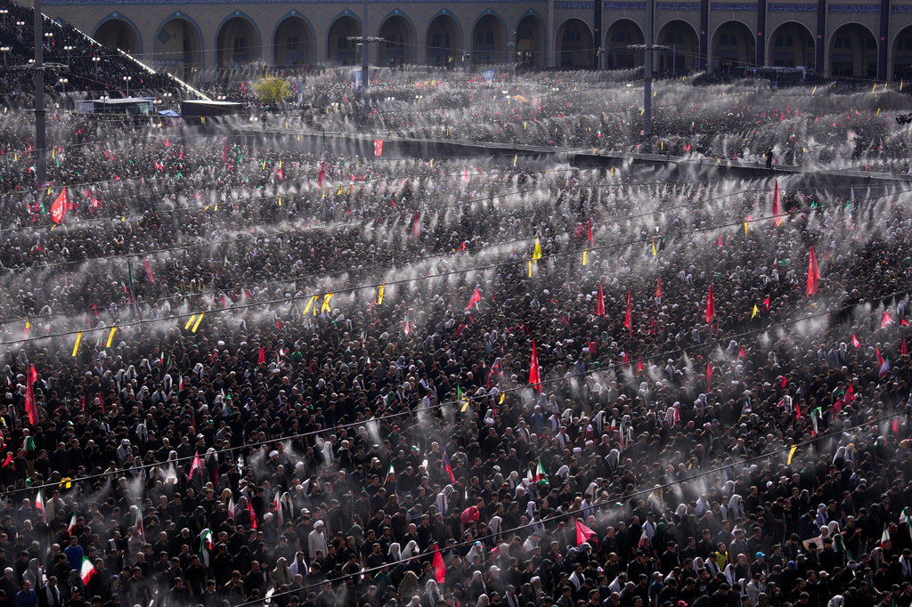 Mourners pray during funeral prayers held as part of the dayslong funeral ceremonies for the slain Iranian Supreme Leader Ayatollah Ali Khamenei and members of his family at the Imam Khomeini Mosalla Grand Mosque in Tehran, Iran, Sunday, July 5, 2026. (AP Photo/Altaf Qadri)