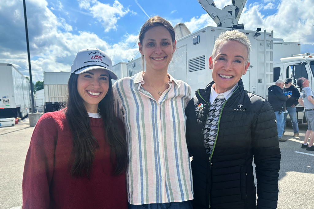 From left, NBC Sports on-air reporter Britney Eurton, producer Lindsay Schanzer and retired jockey-turned-reporter Donna Brothers pose for a photo at Churchill Downs in Louisville, Ky., Wednesday, April 29, 2026. (AP Photo/Stephen Whyno)
