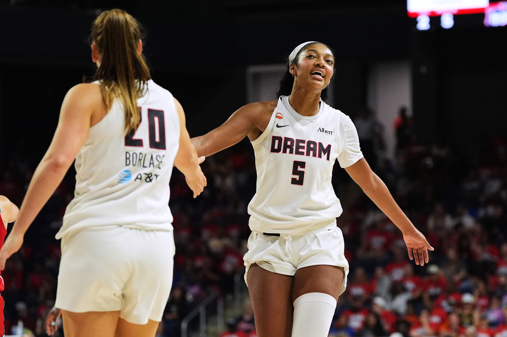 Atlanta Dream forward Angel Reese (5) celebrates with guard Isobel Borlase (20) after their team was fouled against during the second half in Game 2 of a WNBA basketball first-round playoff series against the Washington Mystics, Wednesday, Sept. 30, 2026, in Washington. (AP Photo/Stephanie Scarbrough)