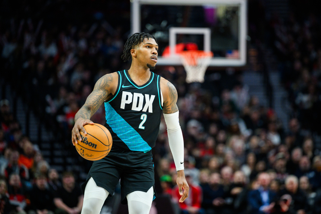 Portland Trail Blazers guard Caleb Love dribbles downccourt during the first half of an NBA basketball game against the Utah Jazz, Monday, Jan. 5, 2026, in Portland, Ore. (AP Photo/Molly J. Smith)