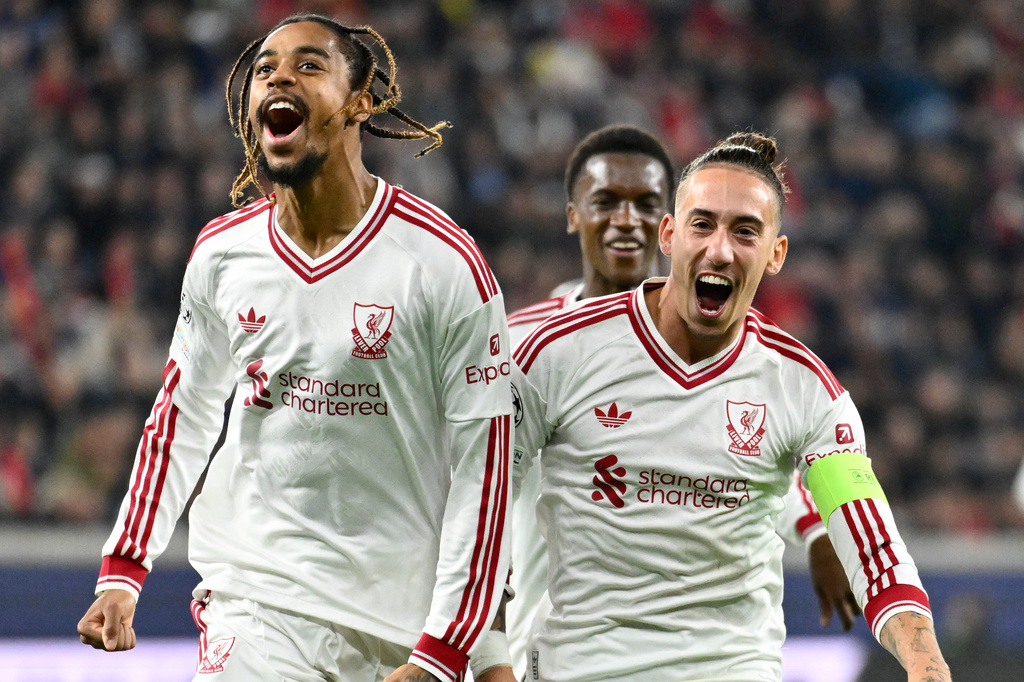 Liverpool's Bradley Barcola, left, celebrates after scoring his side's second goal during the Champions League opening phase soccer match between LASK and Liverpool in Linz, Austria, Wednesday, Oct. 14, 2026. (AP Photo/Denes Erdos)