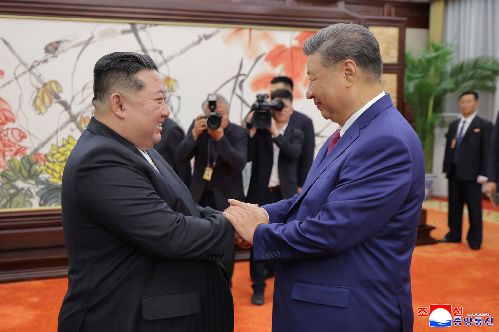FILE - In this photo provided by the North Korean government, North Korean leader Kim Jong Un, left, shakes hands with Chinese President Xi Jinping in Beijing Thursday, Sept. 4, 2025. Independent journalists were not given access to cover the event depicted in this image distributed by the North Korean government. The content of this image is as provided and cannot be independently verified. Korean language watermark on image as provided by source reads: "KCNA" which is the abbreviation for Korean Central News Agency. (Korean Central News Agency/Korea News Service via AP, File)