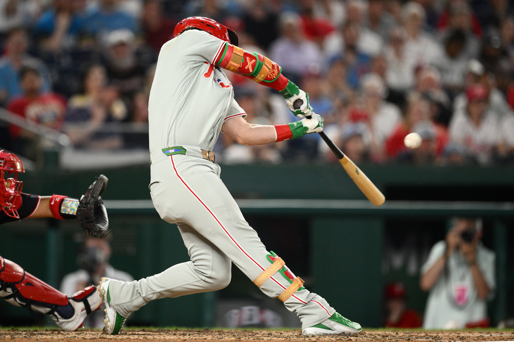 Philadelphia Phillies' Bryce Harper hits a two-run home run during the ninth inning of a baseball game against the Washington Nationals, Thursday, June 25, 2026, in Washington. (AP Photo/Nick Wass)