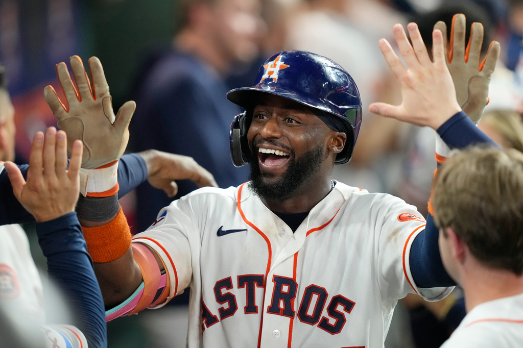 Houston Astros' Taylor Trammell celebrates in the dugout after hitting a three-run home run against the Toronto Blue Jays during the fifth inning of a baseball game Tuesday, Aug. 4, 2026, in Houston. (AP Photo/David J. Phillip)