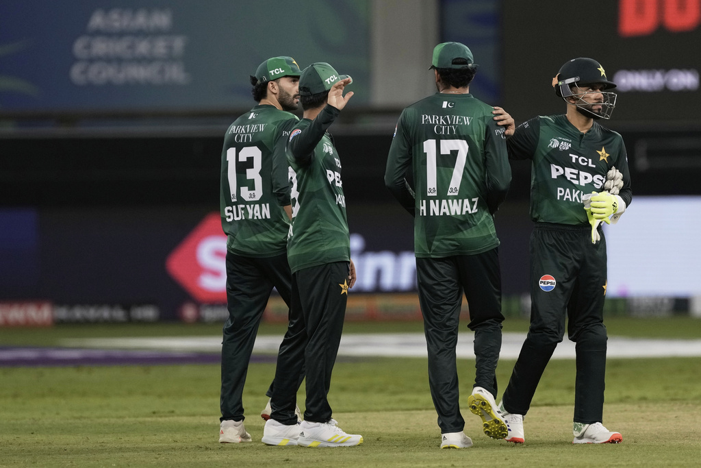 Pakistan players react after their loss in the Asia Cup cricket match against India at Dubai International Cricket Stadium in Dubai, United Arab Emirates, Sunday, Sept. 14, 2025. (AP Photo/Fatima Shbair)