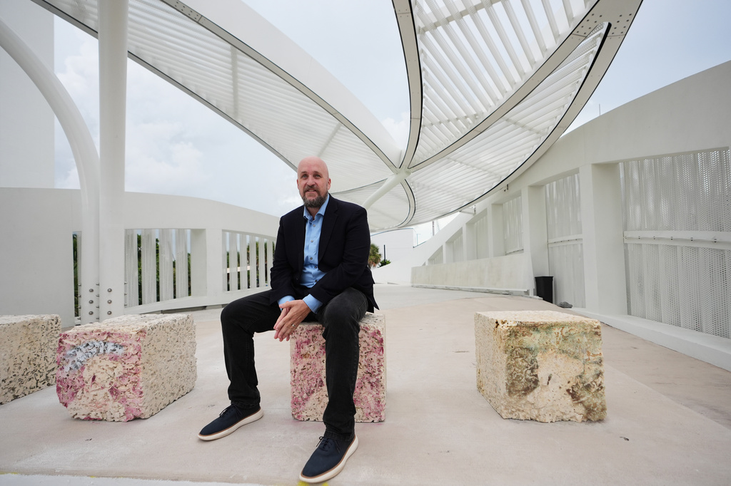 Jeffrey Huber, a landscape architect and professor, poses for a photograph at DC Alexander Park, a former parking lot that was transformed into a public space that doubles as flood infrastructure, Wednesday, Aug. 5, 2026, in Fort Lauderdale, Fla. (AP Photo/Lynne Sladky)