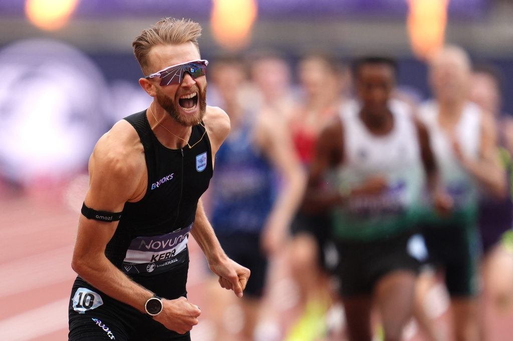 Britain's Josh Kerr celebrates after winning and breaking a world record in the Men's 1 Mile final during the Novuna London Athletics Meet at the London Stadium, Saturday July 18, 2026. (Adam Davy/PA via AP)