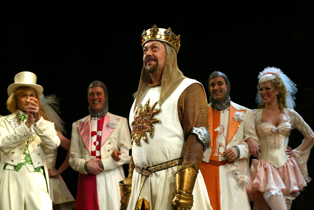 FILE - Tim Curry performs a number from the musical "Spamalot" during the Broadway premiere on March 17, 2005, in New York, (AP Photo/Stuart Ramson, File)